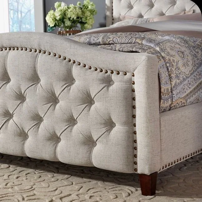 Upholstered bed with cream nail trim Tucho Beds More